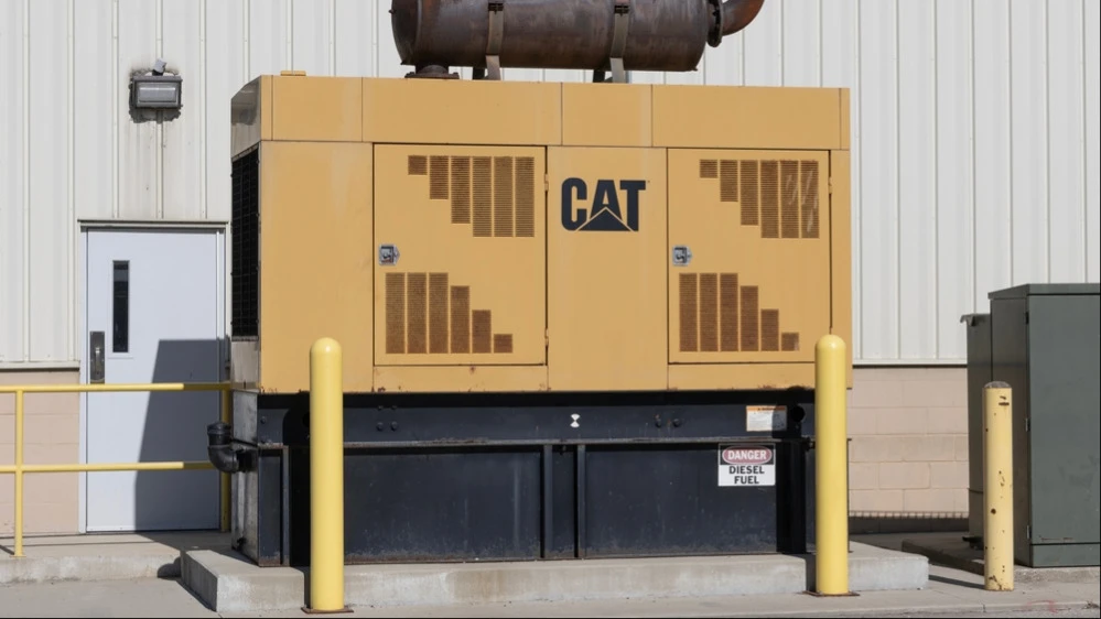 Shares of equipment maker Caterpillar are having their best day in 16 years. What does this have to do with AI?